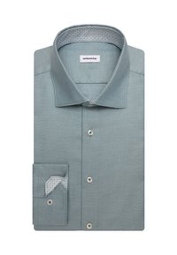 Chemise habillée pour homme vert clair texturée pliée, avec col intérieur à motif et poignet à un bouton, étiquette de marque visible à l’intérieur du col.