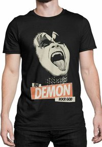 Mustat puuvillapaita, jossa on graafinen printti henkilöstä, jolla on dramaattinen meikki, suu laajana auki, ja tekstissä lukee "Demon Rock God."