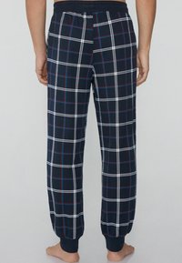 Marinefarbene karierte Schlafanzughosen mit weißen und roten Streifen, featuring einem elastischen Bund und Bündchen, aus weichem Baumwollmaterial.
