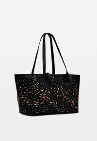 Black tote bag featuring a vibrant pattern of colorful, elongated shapes. Smooth texture with dual black handles, rectangular shape.