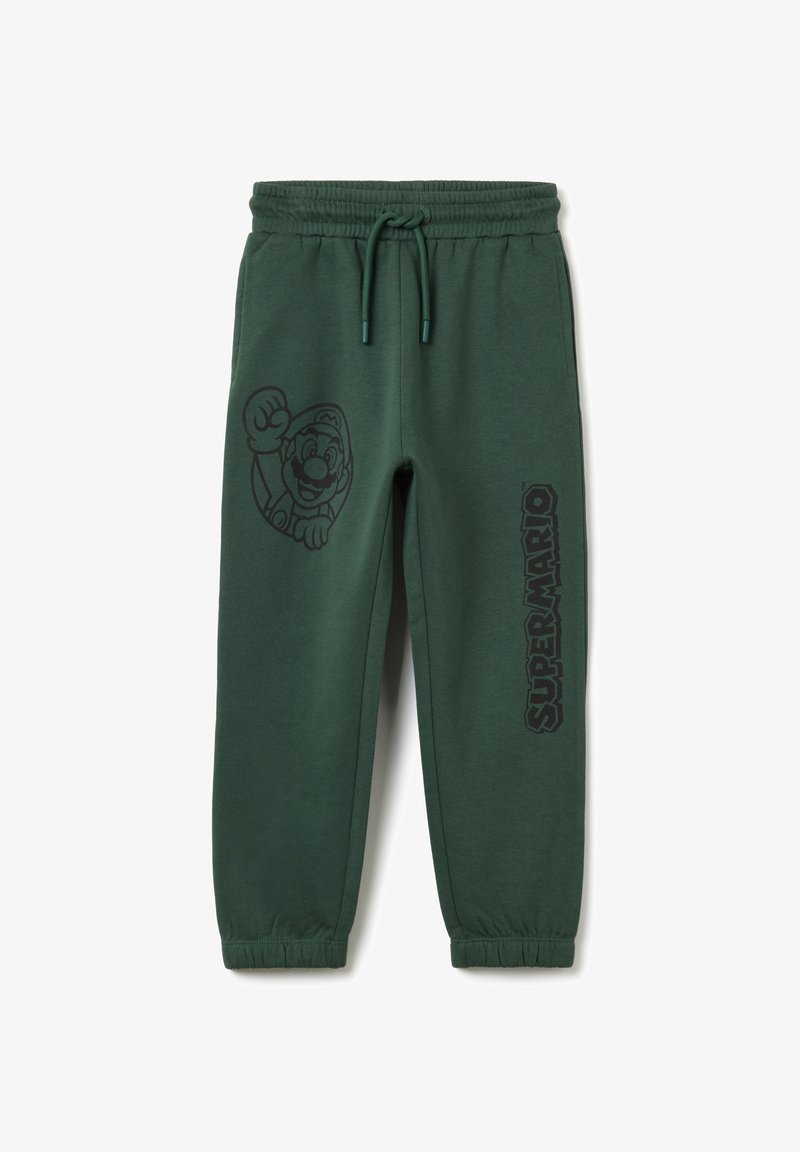 Grüne Sweatpants aus Baumwollmischung, mit einem Mario-Graphic auf der linken Seite und dem Text "SUPER MARIO" auf der rechten. Elastischer Bund.