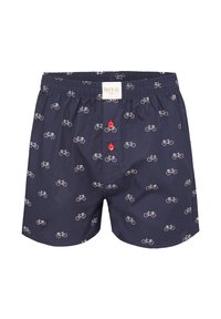 Boxer blu navy con un motivo di biciclette ripetuto in bianco, con un morbido elastico in vita e bottoni rossi sul davanti.