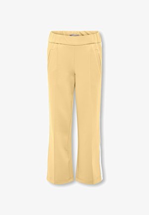 Pantalons jaunes confortables avec une taille large, deux poches latérales et des bandes blanches sur le côté. Texture douce et coupe décontractée.