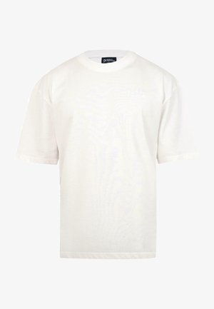T-shirt blanc à manches courtes en coton, avec un col rond et un logo simple à l'avant. Texture douce et coupe décontractée.