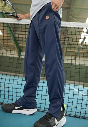 Nike Performance HERITAGE SUIT PANT - Pantalones deportivos - thunder blue