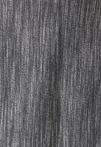 Woven fabric with a textured pattern in shades of black and white. Features a subtle striped appearance and a soft, dense texture.
