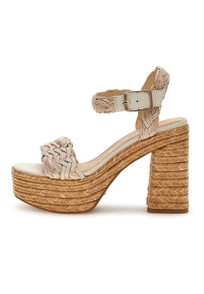 Woven beige fabric upper, wide strap, ankle buckle, natural straw platform and block heel with textured, layered design.