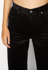 Monki Tygbyxor - black