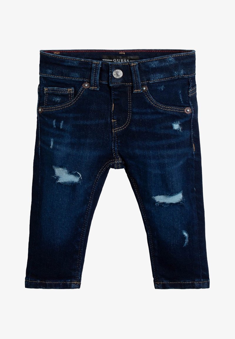 Tummansiniset farkkushortsit, joissa on kulutettuja yksityiskohtia, viisi taskua ja hopeanväriset yksityiskohdat. Ombroity akcentti erottuu kankaan rakenteesta.