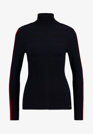 Navy turtleneck sweater with ribbed texture and horizontal striped pattern on the front. Features bright red stripe along each sleeve.