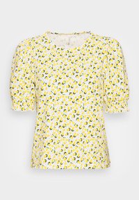 Biała bluzka z krótkimi bufkowymi rękawami, elastycznymi mankietami oraz żółtym nadrukiem cytryn z zielonymi liśćmi i małymi czarnymi kropkami.