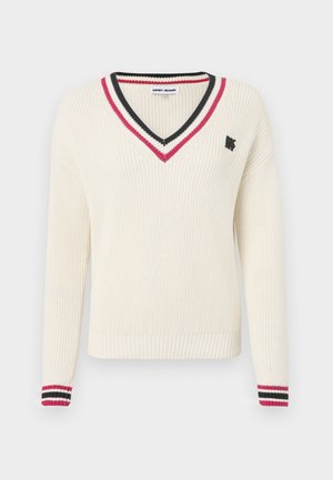 Cream v-neck sweater with ribbed texture, featuring red and black striped accents on the collar and cuffs, and a small logo on the chest.