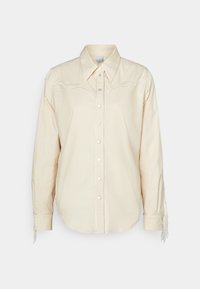 Lichtbeige katoenen overhemd met geborduurde accenten en franjes op de mouwen; beschikt over een puntige kraag en voorste knopen.