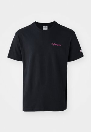 Black cotton t-shirt featuring short sleeves, a crew neckline, and a pink "Champion" logo embroidered on the chest and sleeve.