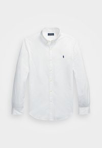 White long-sleeve button-up shirt made of cotton, featuring a pointed collar and a small blue logo on the chest. Yellow buttons detail the front.