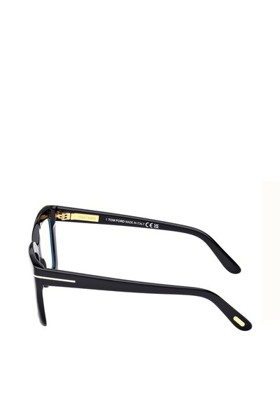 Lunettes en acétate noir avec accents dorés, forme rectangulaire et branches fines. Finition texturée avec gravure "TOM FORD MADE IN ITALY".