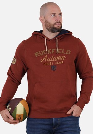 Haut à capuche bordeaux avec cordon de serrage, poche avant et texte brodé "Ruckfield Autumn Rugby Camp". Tissu en mélange de coton avec une texture lisse.