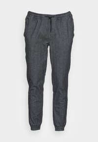 Tmavě šedé tepláky s elastickým pasem, detailem na stažení, zúženými nohavicemi a elastickými manžetami. Texturovaná tkanina s melírovaným vzorem.