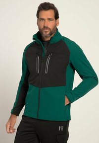 Fleecejacka med grön och svart färgsättning, två bröstfickor med dragkedja och hög krage för extra värme.