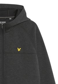 Felpa grigia con zip e cappuccio aderente, realizzata in tessuto testurizzato. Presenta un piccolo logo di un uccellino giallo sul petto sinistro e tasche frontali.