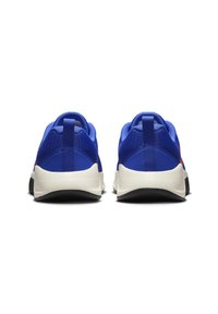 Blue mesh athletic shoes with a textured upper, white midsole, and black rubber outsole. Features a rear pull-tab for easy wear.