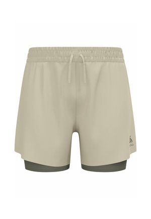 Shorts de sport beige avec une finition texturée, dotés d'une taille élastique avec cordon de serrage et d'une doublure intérieure vert foncé.