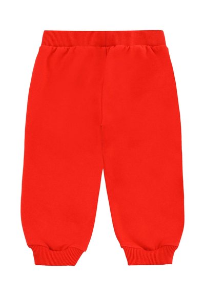 Rode trainingsbroek met een elastische tailleband, boorden bij de enkels en een zachte textuur. Glad materiaal zonder patronen of extra accenten.
