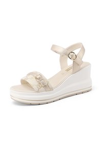 Sandali con zeppa beige con cinturini metallici, tomaia con motivo e suola platform bianca. Presentano un cinturino alla caviglia regolabile con fibbia.