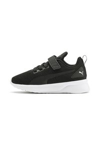 Chaussure de sport noire avec texture en maille, dotée d'une sangle Velcro, d'une semelle blanche rembourrée et d'un petit accent logo sur le côté.