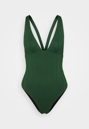 Roheline soonik ujumiskostüüm sügava V-kaelusega, laiad õlapaelad ja must vooder. Sile tekstuur ja keha lähedane siluett.