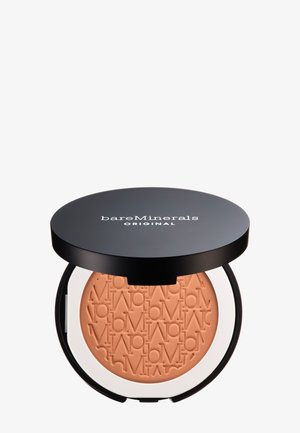 BareMinerals Original losse poederfoundation in een ronde zwarte container, textuur nude poeder met gegraveerde branding, deksel iets open.