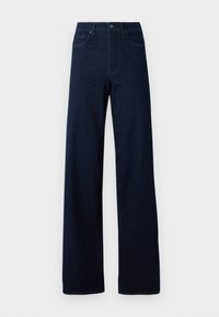 Jean bleu foncé à jambes larges, taille haute, fermeture par boutons et poches avant, présenté sur un fond clair uni.