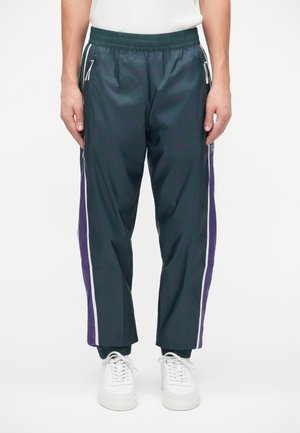 TRAIN GRAPHIC SERIES PANTS MONOGRAM - Tepláky - dark green fancy