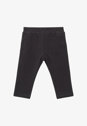 Schwarze Stretch-Baumwollleggings mit elastischem Bund und zwei Vordertaschen mit Ziernähten. Glatte Textur und figurbetontes Design.