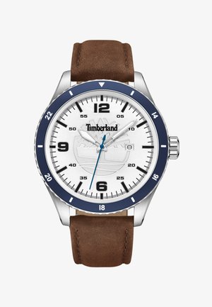 Zegarek Timberland z srebrną kopertą, białą tarczą, granatowym pierścieniem, brązowym skórzanym paskiem i niebieskim akcentem na sekundniku. Czarne znaczniki godzinowe.