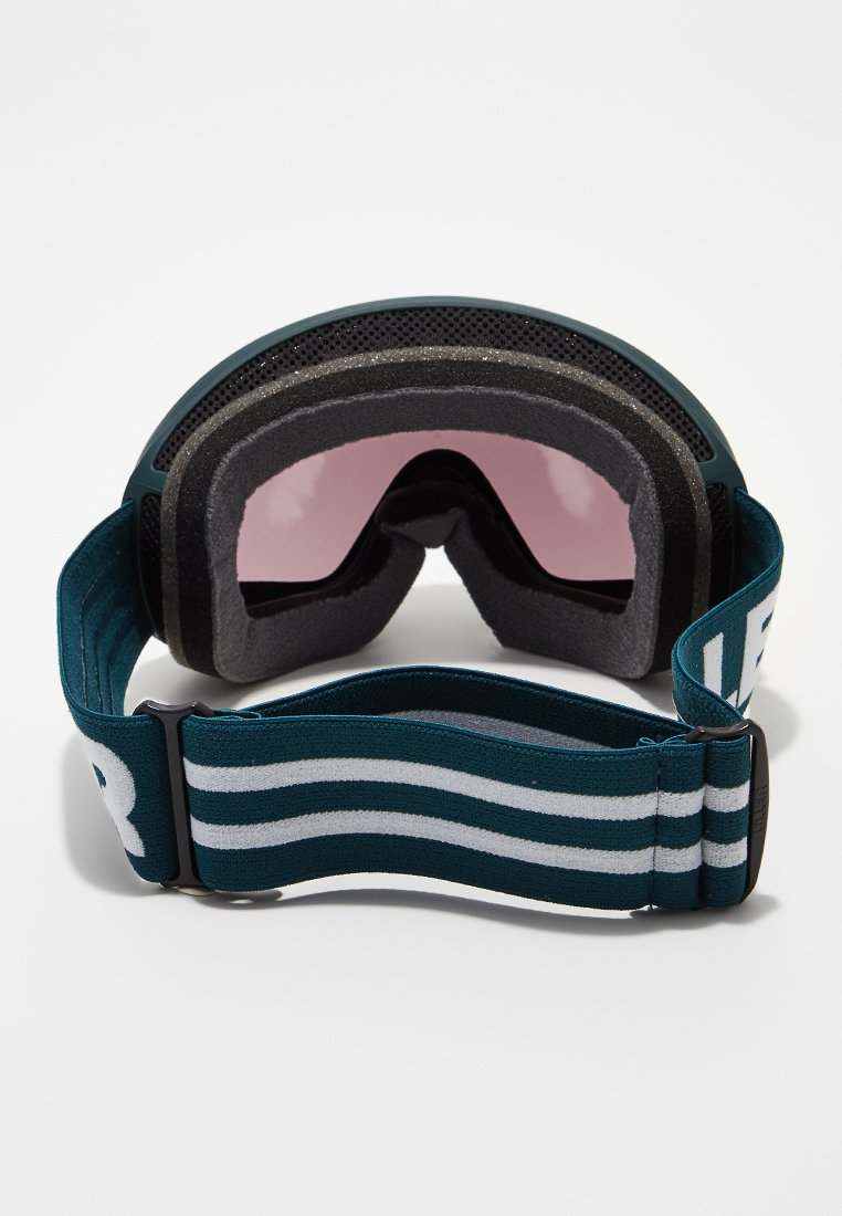 Skibril met een zwarte rand, grijze schuimvulling en roze lenzen. Voorzien van een teal band met witte strepen en logo-opdruk.