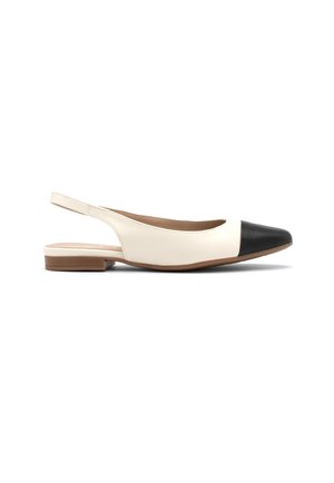 Slingback flats with a cream leather upper and black leather cap toe. Features a low brown heel and a smooth, minimalist design.