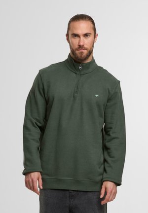 Grüner Reißverschluss-Fleece-Pullover mit langen Ärmeln, hohem Kragen und kleinem Logo auf der Brust. Hat eine glatte Textur und einen lockeren Schnitt.
