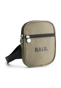 Rectangular canvas crossbody bag in olive green with black zipper, logo print, and adjustable strap. Textured surface and metal hardware accents.