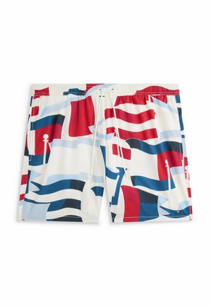 Bañador corto de hombre con cintura elástica y cordón, con un patrón abstracto de bandera en rojo, blanco y azul sobre fondo blanco.