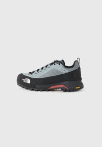 Gray and black hiking shoe with Gore-Tex upper, reinforced toe cap, and Vibram outsole, featuring black laces and a pull tab at the heel.
