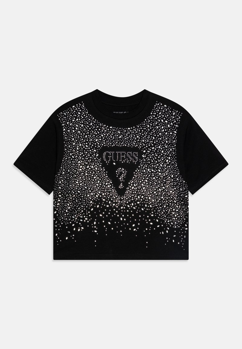 Svart avkortet t-skjorte med sølv rhinestone-detaljer, med et trekantet logo med ordet "GUESS" i sentrum og et gradientdesign.