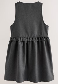 Gray sleeveless dress with a ruffled waistline. Features a textured fabric and a flared skirt, ending just above the knee.