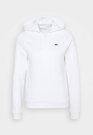 Witte hoodie met ritssluiting, zakken, capuchon met trekkoord en klein groen krokodillenlogo op de borst.