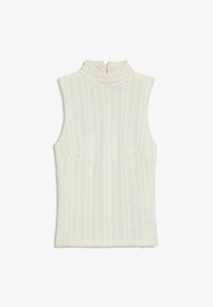 Valkoinen pitsitoppi ilman hihnoja, jossa on korkea röyhelökaulus sekä teksturoidut geometriset ja kukkakuviot.