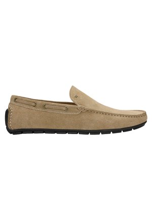 Beige Wildleder Slipper mit abgerundeter Spitze, schlupfdesign, dekorativer Naht und schwarzer Gummisohle. Verfügt über Metallösen für Schnürsenkel.