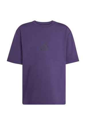 T-shirt de algodão roxa com decote redondo e mangas curtas. Apresenta um logotipo preto na área do peito esquerdo, com design minimalista.