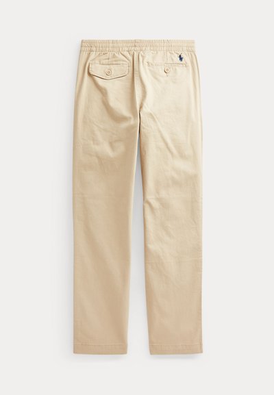 Beige puuvillahousut joustovyötäröllä, kaksi takataskua napilla ja pieni logo vasemmalla edessä. Suora lahkeiden muotoilu ja sileä pinta.