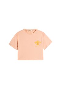Perzikkleurige cropped t-shirt gemaakt van zachte katoen. Heeft korte mouwen en een gele grafische print aan de linkerkant.