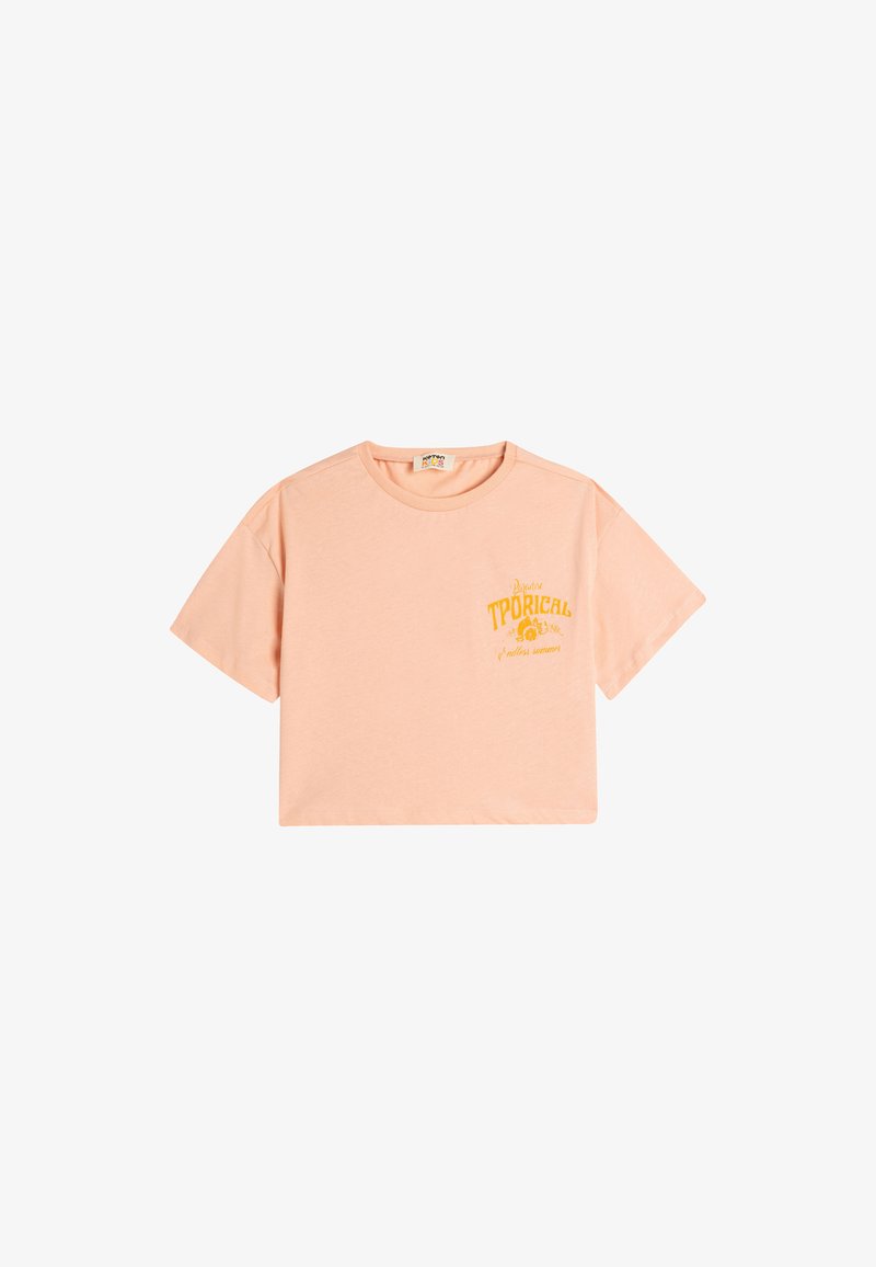 Persikorange, cropped t-shirt lavet af blød bomuld. Har korte ærmer og et gult grafisk print på venstre side.